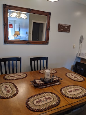 Dining table seating for 6 with 3 additional barstool seatings on kitchen island