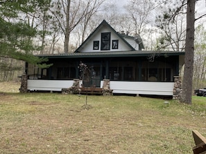 Front of the house with huge screened in porch