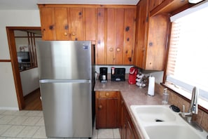 Kitchen is fully stocked and has new appliances