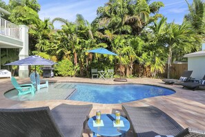 Expansive, tropical courtyard pool area with options for lots of sun or shade