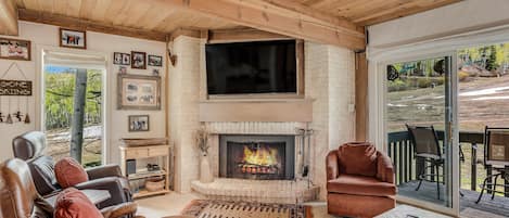 Living room with wood-burning fireplace