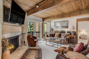 Living room with wood-burning fireplace