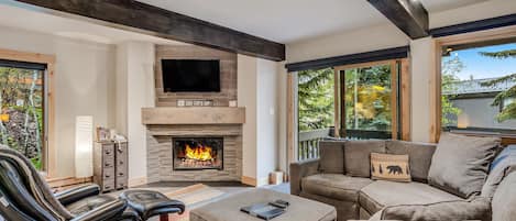 Living room with wood-burning fireplace
