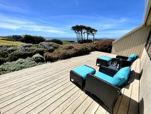 Deck with view of ocean and gulf course