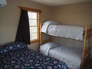 MAIN ROOM:  Another angle of the main room, highlighting the full-size bed and the bunk bed.