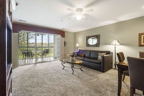 Living Area with Cable, 
Flat Screen and Sunroom Access