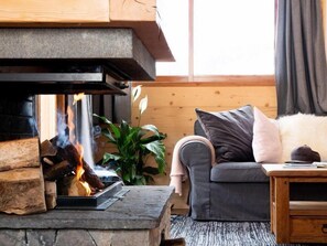 Warm up by the wood-burning fireplace after a day on the pistes.