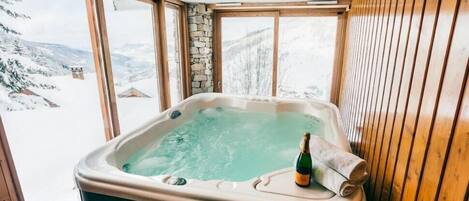 Relax in the lovely hot tub.