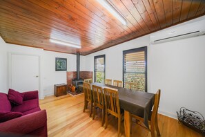 large extendable dining table that seats 10, fireplace & split system A/C.