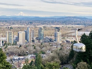The view of John Ross from OHSU campus with tram coming up from South Waterfront