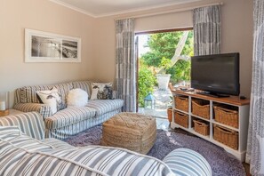 Lounge opens onto garden, satelite TV