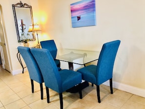 Good size dining table next to kitchen and living room
