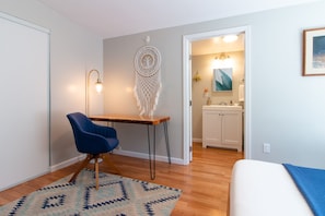 Comfortably work and take meetings at the chic desk in the Master Bedroom.