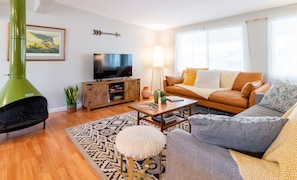 Hang out with games, a Wii and a Smart TV. (Note: Fireplace is decorative only.)