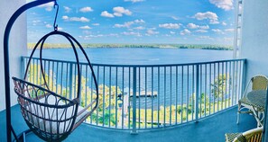 Relax on this swing with a gorgeous view of the lake from your balcony