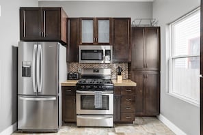 Plenty of cabinet space to bring food for your stay, and a fully equipped kitchen with all of the utensils you'd need to make a home-cooked meal.