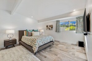 Master Bedroom with Queen Bed, En Suite Bath and Walk In Closet