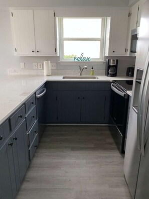 The kitchen is remodeled with all-new appliances. The dishwasher is so quiet!