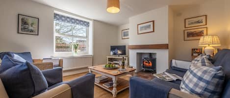 Pink End: The cosy sitting room has a wood burning stove