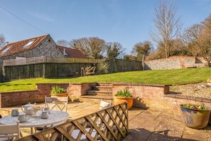 Pink End, North Creake: Dining al fresco in the enclosed garden