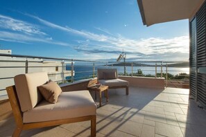 Sunny terrace and outdoor furniture in  Croatia luxury vacation villa Sea Flower in Rogoznica by the sea.