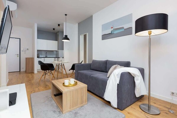 Living room with a comfortable sofa and TV. 