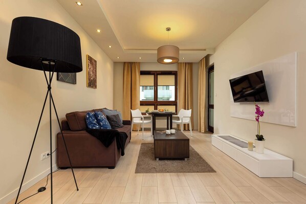 Living room with a comfortable sofa and TV. 