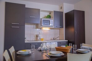 Prepare a meal in the equipped kitchen.