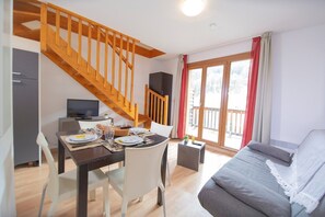 Relax and rejuvenate in the cozy living room. Please note that the TV is available for an additional charge.