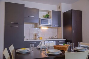 Prepare a meal in the equipped kitchen.