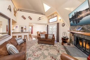 Living room with Fireplace and TV. great for movie nights!