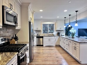 Custom Upgraded Kitchen with Stainless Steel Appliances and Granite Countertops