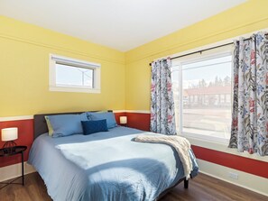 Queen sized bed with window view