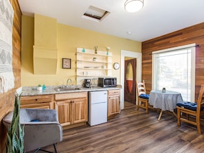 Cozy Corner Suite #3 has a kitchenette with microwave, coffee maker, toaster, mini-fridge, dishes, towel, sponge, soap and paper towels. 
Dining table for two to enjoy morning coffee and a little breakfast. 

++ADULTS ONLY++