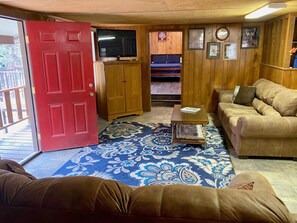 Shady Oak - Living room leads to large covered porch.