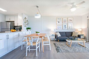 Open-concept living and dining space with contemporary furnishings and a welcoming atmosphere.