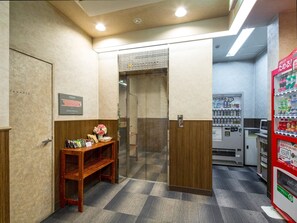 ・ Elevators and vending machines are installed in the building.
