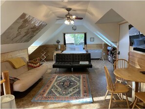 Looking towards futons, queen bed, and dining area