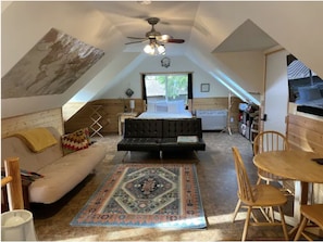 Looking towards futons, queen bed, and dining area