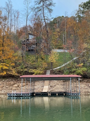 Private dock with 2 covered slips & smooth concrete walkway. (Fall water level)