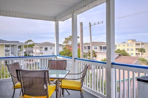 Top floor balcony with patio seating.  This condo is an end unit.