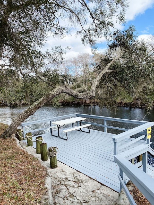 You'll love eating all of your meals on the dock over the river.