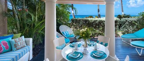 Enjoy alfresco dining and view of Barbados' Reeds Bay from patio