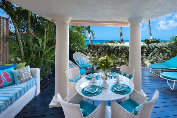 Enjoy alfresco dining and view of Barbados' Reeds Bay from patio