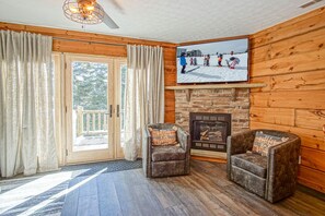 The doors that lead to the hot tub and the gas fireplace.