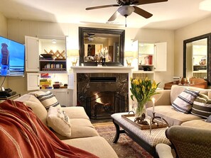 This is the formal Living Room with fireplace. (The TV/game room is next to it).