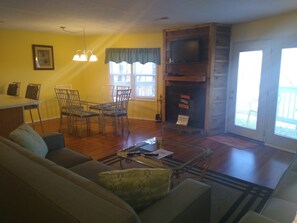 Large living room with Smart Tv and Full-size Pull-out couch. 