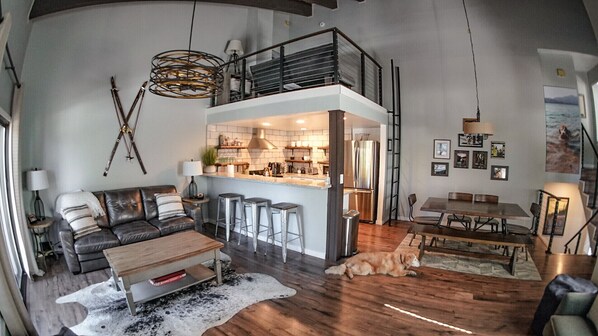 Main Living Area on second floor with dining, kitchen, desk, fireplace.