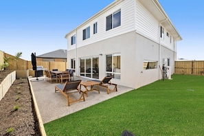 Kids will love being able to come and go from the backyard and lawn for outdoor play, and parents will appreciate the secure, fully fenced yard and some toys for their entertainment. 