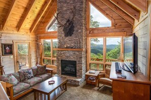 Living Room with Vaulted Ceiling and Stone Fireplace